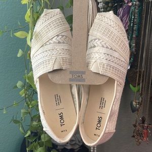 Tom’s white slip-ons (never worn)